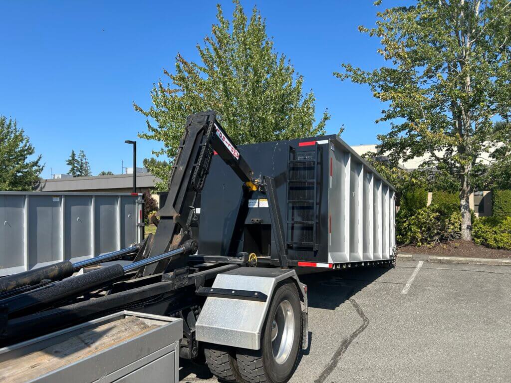 An Onestop Bin Rental bin being unloaded